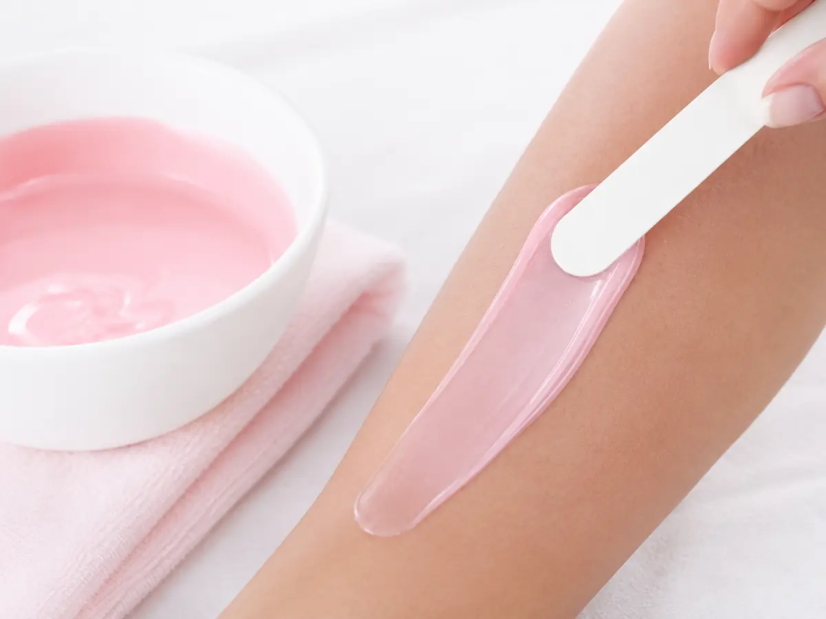 Professional waxing preparation with warm wax and clean applicators
